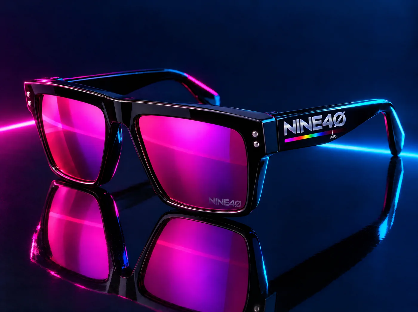 NINE40 Neon Driver square sunglasses in thick gloss black acetate with a hot magenta mirror lens, the NINE40 logo and spectrum bar on the outer temple, and the mark inside the lens